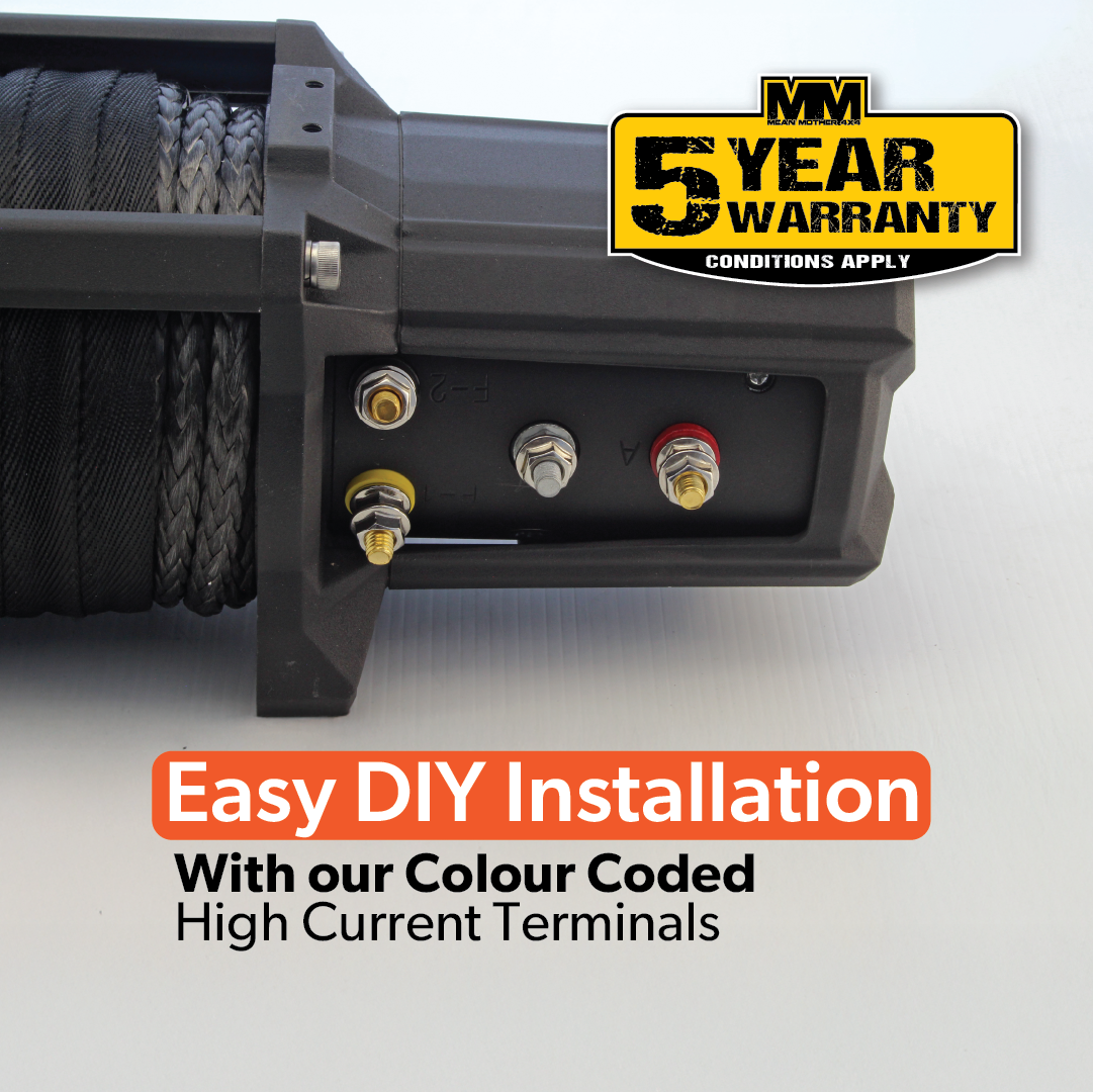 A close-up of the 12500LB Tough Mumma winch by Mean Mother 4x4, featuring color-coded high current terminals and UHMWPE synthetic rope. Text states, "Easy DIY Installation With our Colour Coded High Current Terminals." A "5 Year Warranty" label assures your winch is ready for any challenge.