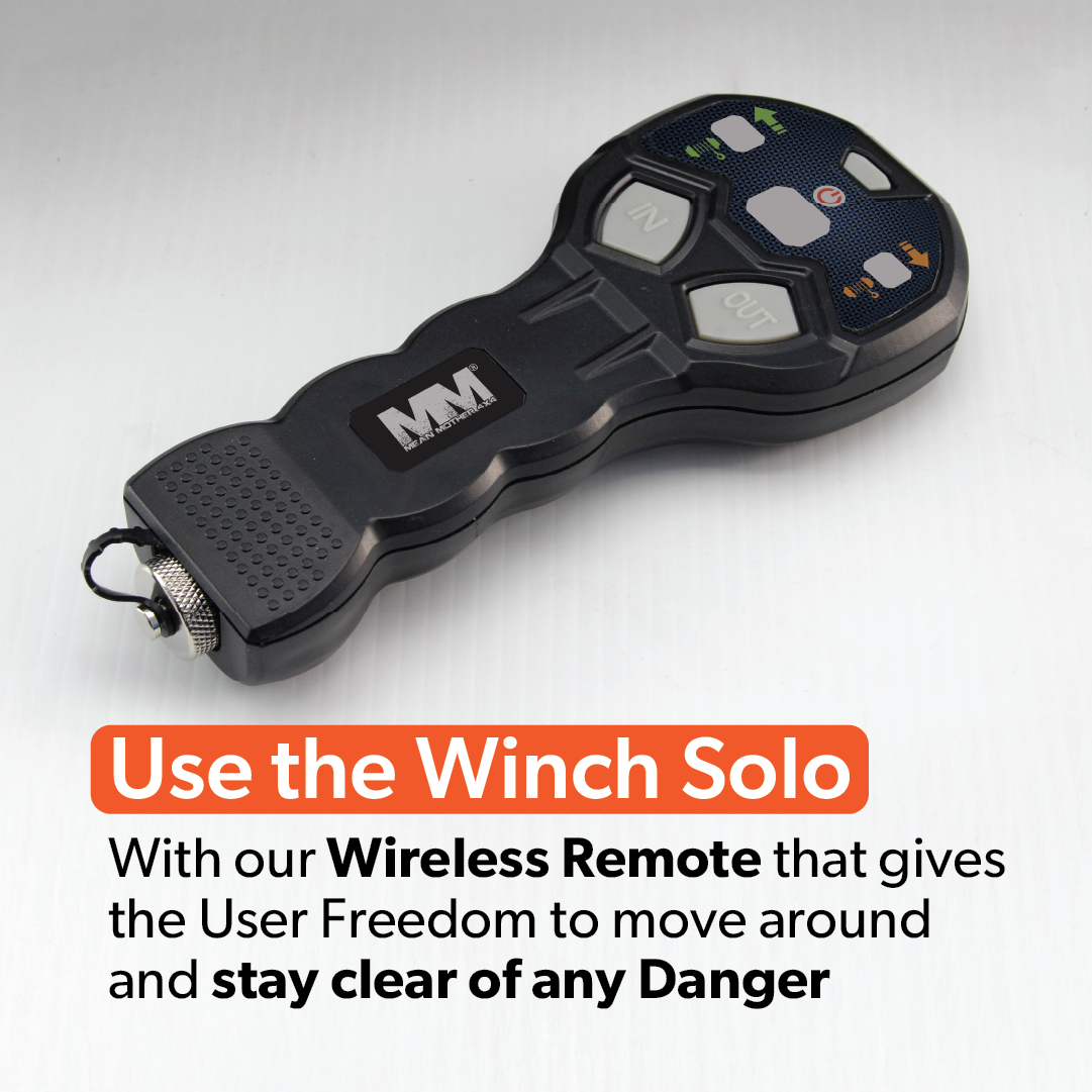 A black wireless remote with "IN" and "OUT" buttons is displayed on a white surface. Text reads, "Use the Mean Mother 4x4's 12500LB Winch Solo. The Wireless Remote for the 4x4 Winch offers freedom to move safely and avoid danger with ease.