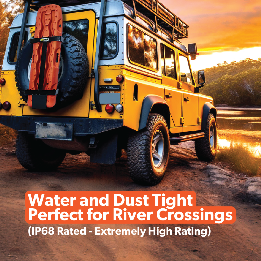 Mean Mother 4x4's "Tough Mumma" is a rugged yellow off-road vehicle by the river at sunset, outfitted with adventure gear, a 12500LB 4x4 winch with IP68 rating for water crossings, and UHMWPE synthetic rope to ensure durability on any terrain.