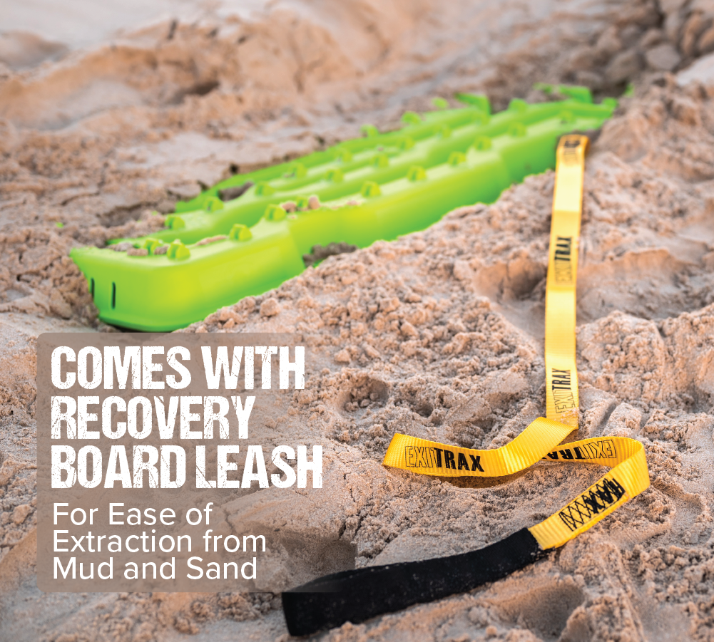 An Aqua Marine Exitrax Recovery Board Ultimate 1150 is positioned on sandy terrain, accompanied by a yellow and black leash. The label reads, "Includes recovery board leash for easy extraction from mud and sand." Designed for adventurers seeking a dependable escape option in difficult conditions.