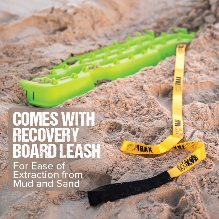 A Blood Orange Exitrax Recovery Board Ultimate 1150 is partially buried in sand. Attached to it is a yellow and black recovery board leash extended across the sand. Text overlay reads "COMES WITH RECOVERY BOARD LEASH For Ease of Extraction from Mud and Sand.