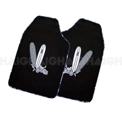 The Mean Mother 4x4 Floor Mats Surfs Up Blue features two black mats, each with a central design of two crossed surfboards and flowers at the base.