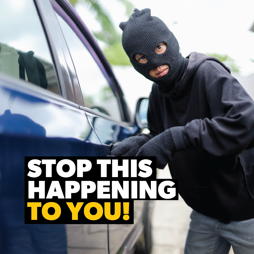 A person in a black ski mask and gloves tries to break into a blue car. Text: "STOP THIS HAPPENING TO YOU!" Protect your vehicle—upgrade with the Sperling Steering Wheel Lock Prolock anti-theft device today.