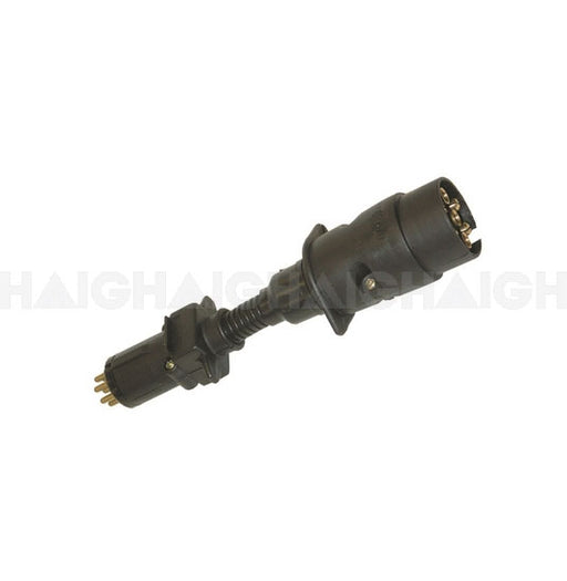 The Mean Mother 4x4 T-Adaptor 7Pin Plug Lge-7Pin Socket is a black cylindrical electrical connector with multiple metal pins and ribbed flexible cable reinforcement, shown against a plain white background.