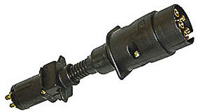 The Mean Mother 4x4 T-Adaptor 7Pin Plug Lge-6Pin Socket is a black plastic wiring adapter with multiple metal pins, designed to connect various vehicle electrical plugs.