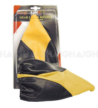 A pair of Mean Mother 4x4 Gearshift Lever Boots Yel in black and yellow, shown in packaging with a leather-like texture and elastic base for easy fitting over gear levers.