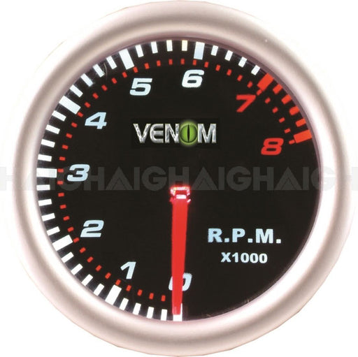 The Mean Mother 4x4 Gauge Venom 2" Tacho features a black face, "VENOM" at the center, 0-11 (x1000) RPM range, needle at 0, redline from 7.5, and clear white and red markings on a black background.