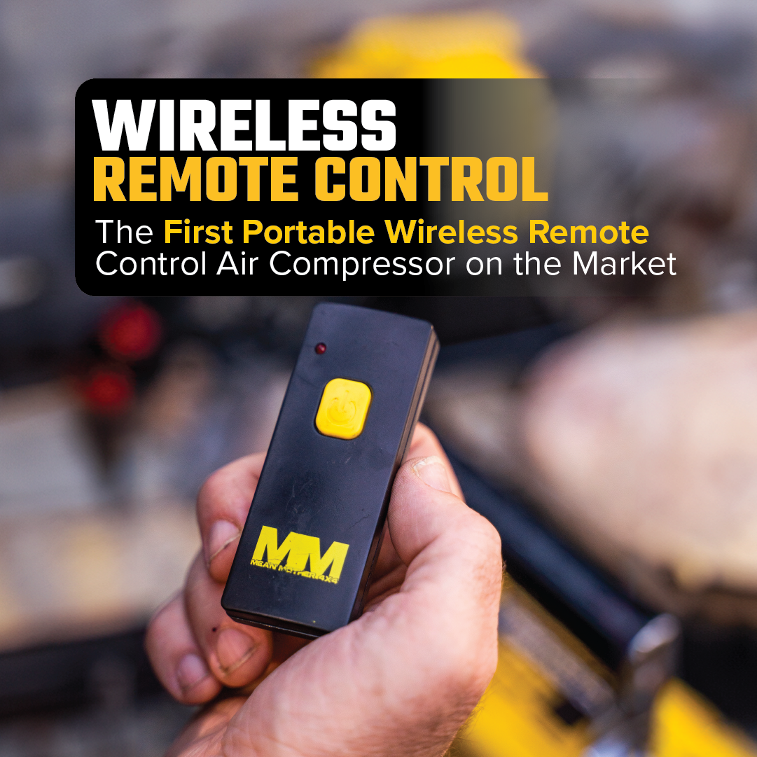 A hand holds a compact black device marked with a yellow button and the letters "MM," signifying its distinction as the inaugural wireless remote control for the Air Compressor with Wireless Remote Control 180lpm by Mean Mother. This state-of-the-art tool offers an impressive 180L/Min free air delivery and is backed by a confidence-inspiring 5-year warranty.