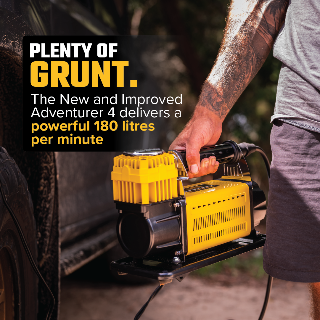 A person with a tattooed arm operates the Mean Mother Air Compressor with Wireless Remote Control 180lpm beside a vehicle. The robust, yellow and black compressor offers an impressive 180L/Min free air delivery. Text on the image highlights its upgraded power and capacity, all backed by a reassuring 5-year warranty.