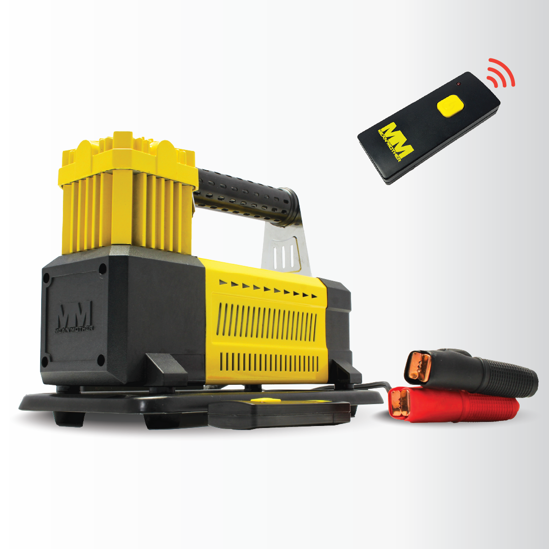 A Mean Mother 4x4 12V Air Compressor 110lpm set: includes a portable yellow and black jack with handle, red and black jumper cables, and a remote control with MM logo—perfect for your 4WD setup. Displayed on white background.