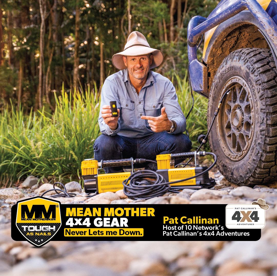 A man in a hat kneels on rocky ground by a blue 4x4, using the Mean Mother 4x4 12V Air Compressor 110lpm. Yellow off-road gear is beside him. Text promotes "Mean Mother 4x4 Gear" and "Pat Callinan’s 4x4 Adventures.