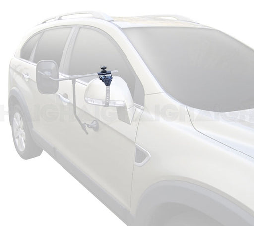 A silver SUV fitted with the Mean Mother 4x4 Mirror Towing Clamp Suit Mh3006 & Mh3007 on the driver’s side mirror to enhance visibility while towing.