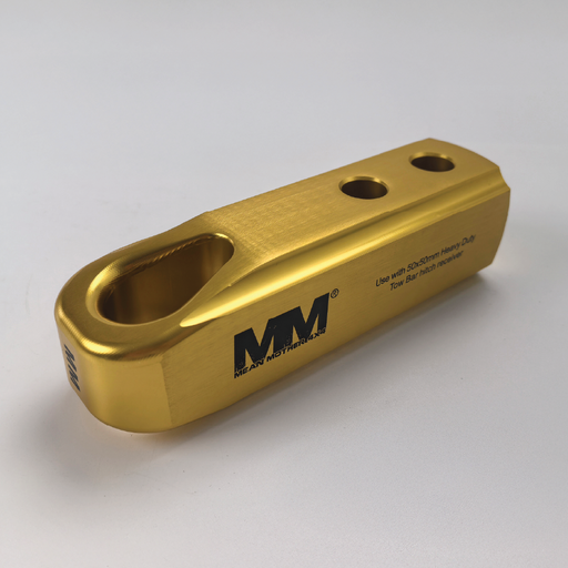 A gold billet aluminium Recovery Hitch by Mean Mother 4x4 with three holes, an oval cutout, and logo; suitable for SDS/Schramm Heavy Duty tow bar heads or use as a 4WD recovery hitch.