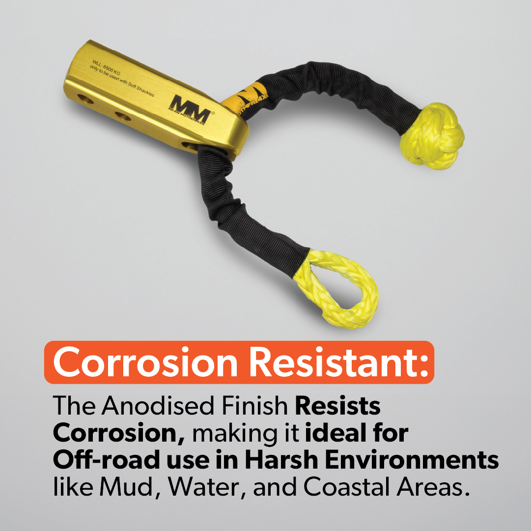 The Mean Mother 4x4 Recovery Hitch is shown with a black and yellow cable on a gray background. Its gold anodized billet aluminium build resists corrosion, making it ideal for off-road 4WD recovery in muddy or wet conditions.