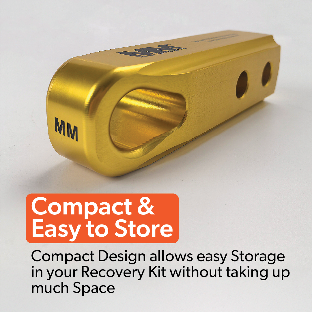 A gold, compact Mean Mother 4x4 Recovery Hitch with "MM" engraved on the end is shown. Text reads: "Compact & Easy to Store. Its design lets you fit it in your 4WD recovery kit without taking up much space.