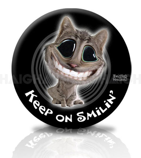 The Mean Mother 4x4 Spare W/Cover "Smiling" C is a round black cover with a cartoon cat—big head, large eyes, wide grin—and the text "KEEP ON SMILIN'" below.