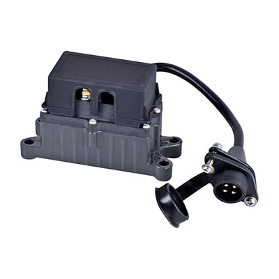 A Mean Mother ATV Solenoid from the Peak series in black, featuring an attached wiring harness with a plug connector. The solenoid has a rectangular shape with a ribbed exterior and mounting holes on both sides for securing it in place. The connector has three metal prongs and a cap, making it ideal for solenoid applications.